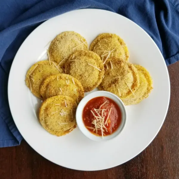 plate filled with air fryer toasted ravioli and tomato sauce