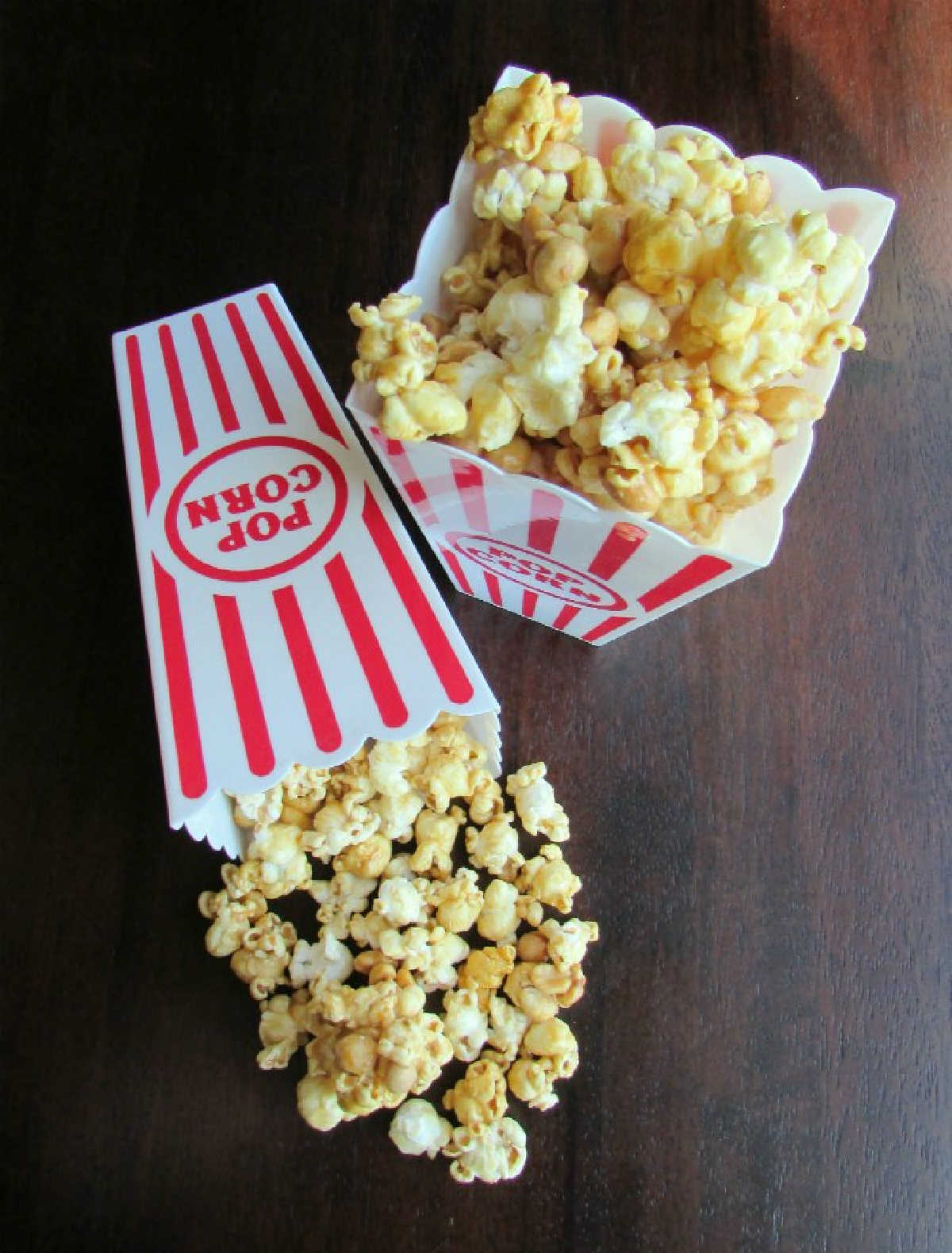 Movie style popcorn containers filled with crunchy microwave caramel popcorn, ready to eat.