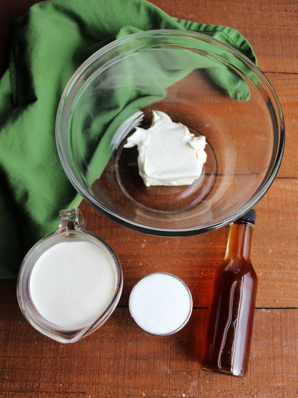Cream cheese whipped cream ingredients including cream cheese, heavy whipping cream, sugar, and vanilla.
