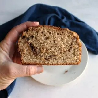 hand holding slice of cinnamon brown sugar bread