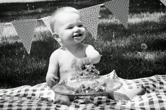 Black and white picture of Little Dude enjoying his first birthday cake.