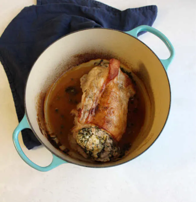 spinach and cheese stuffed pork loin in dutch oven 