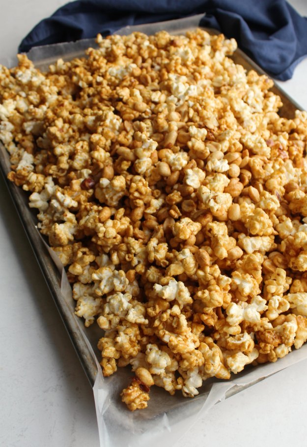 wax paper lined pan filled with cooling caramel corn