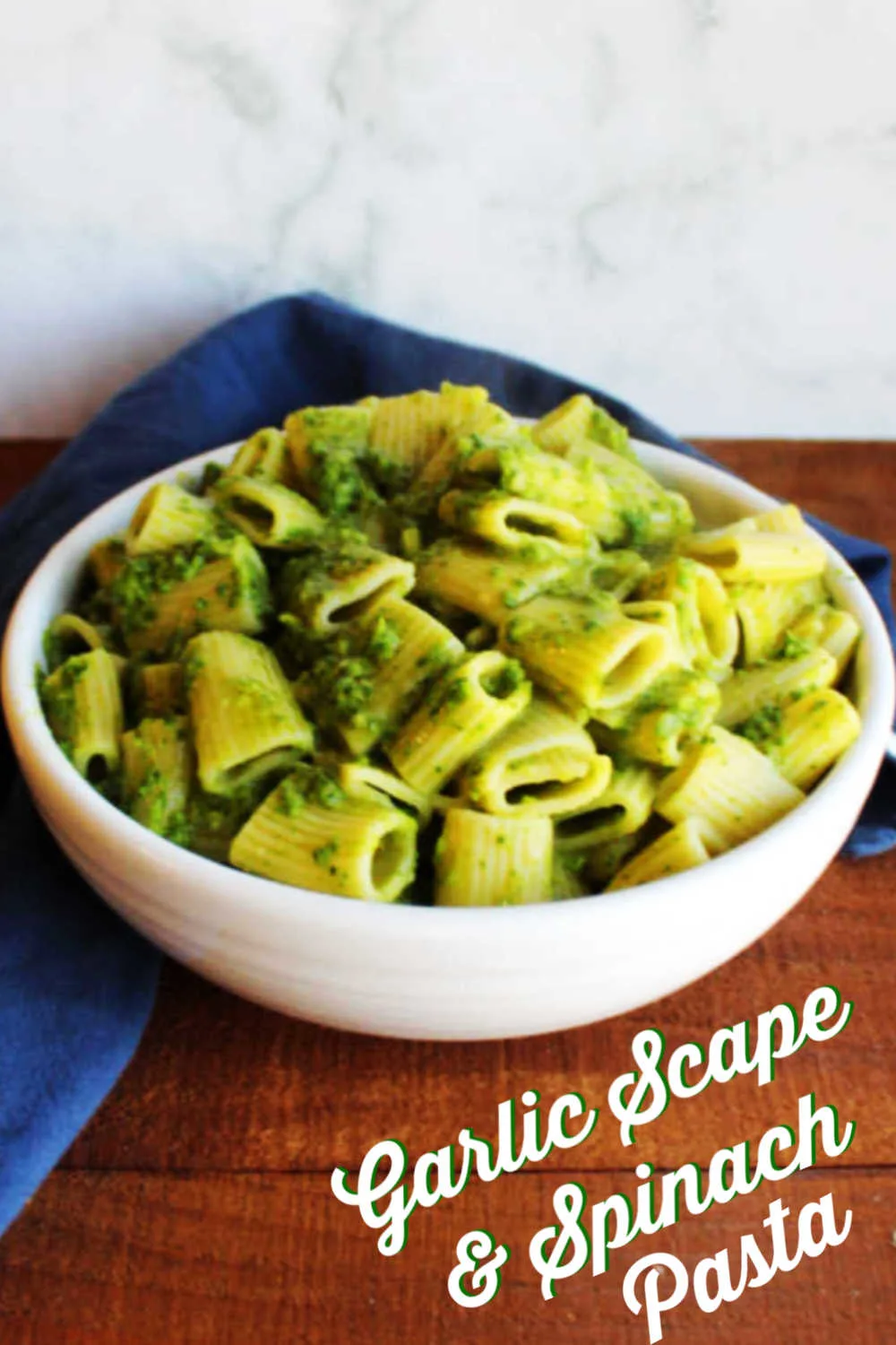 Using fresh veggies and a little pasta is a great way to get a nutritious meal on the table quickly. This simple recipe makes a fabulous pesto style sauce out of fresh spinach and garlic scapes. The result is bright, garlicky and ready in almost no time at all. Serve it as is for a great meatless meal or add chicken or shrimp to make it even more hearty.