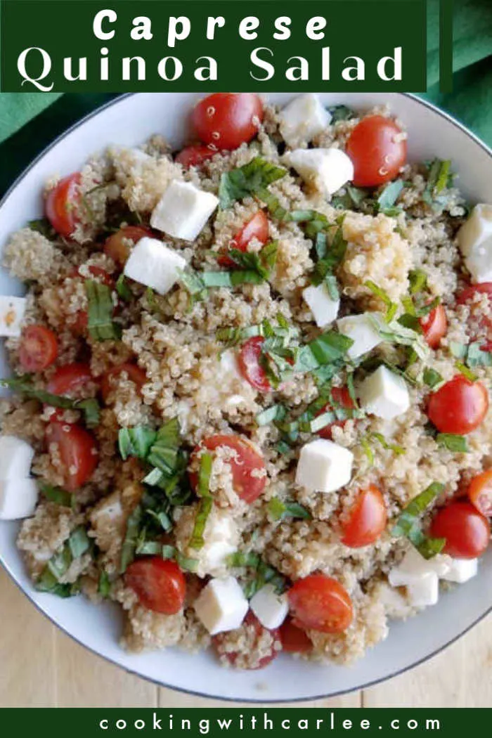 close up of salad showing textures of quinoa, basil, cheese and tomatoes