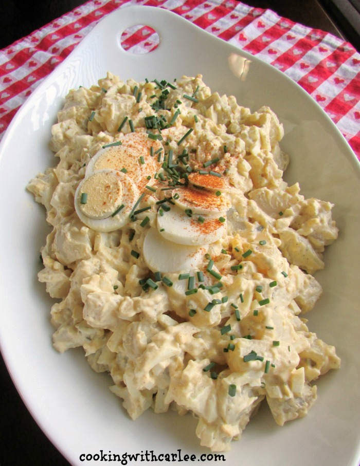 large serving dish filled with deviled egg potato salad.