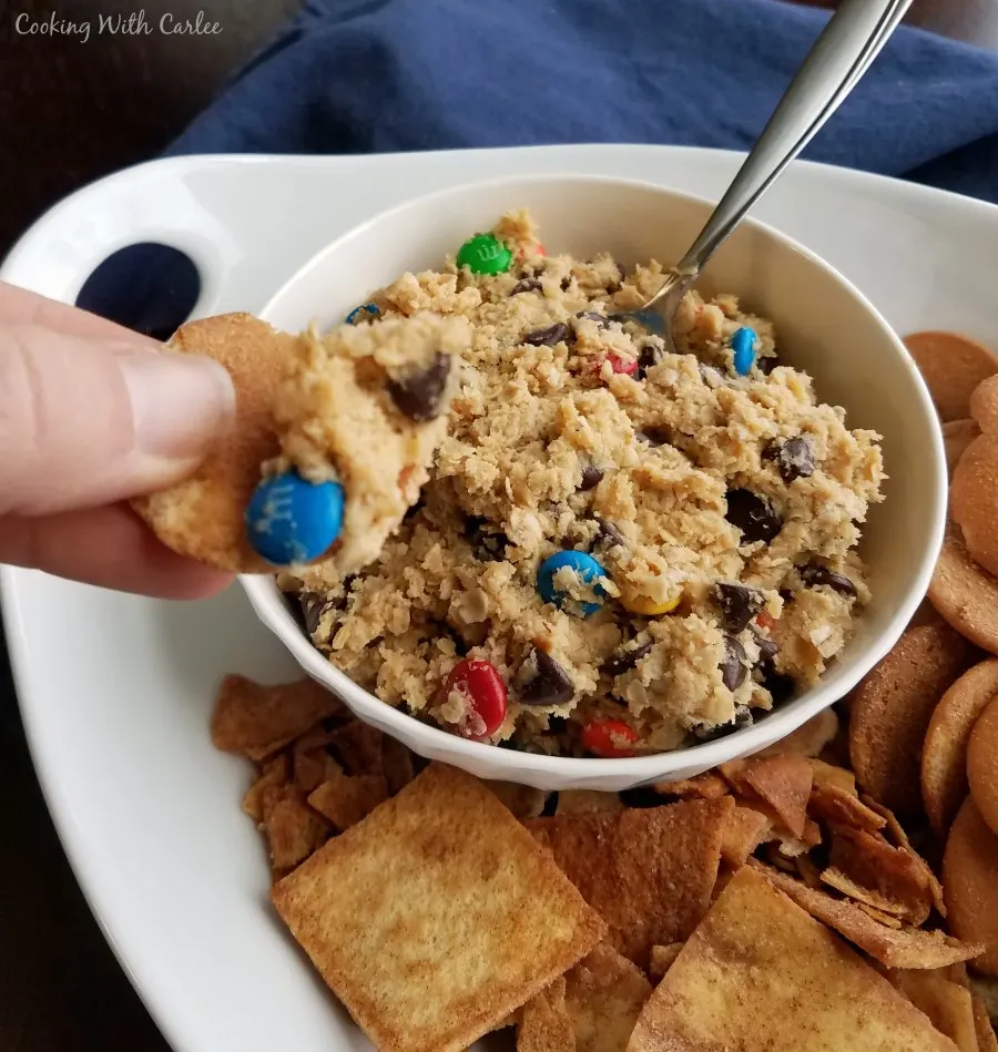 hand cookie into peanut butter oatmeal and chocolate chip dip,