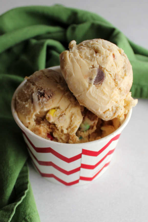 fun paper cup loaded with scoops of monster cookie ice cream