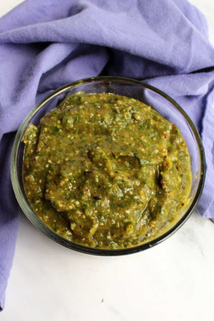 small glass bowl of fresh homemade green salsa