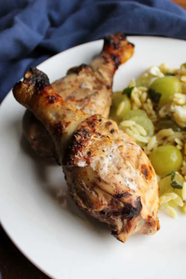 close up of grilled chicken drumsticks ready to eat.