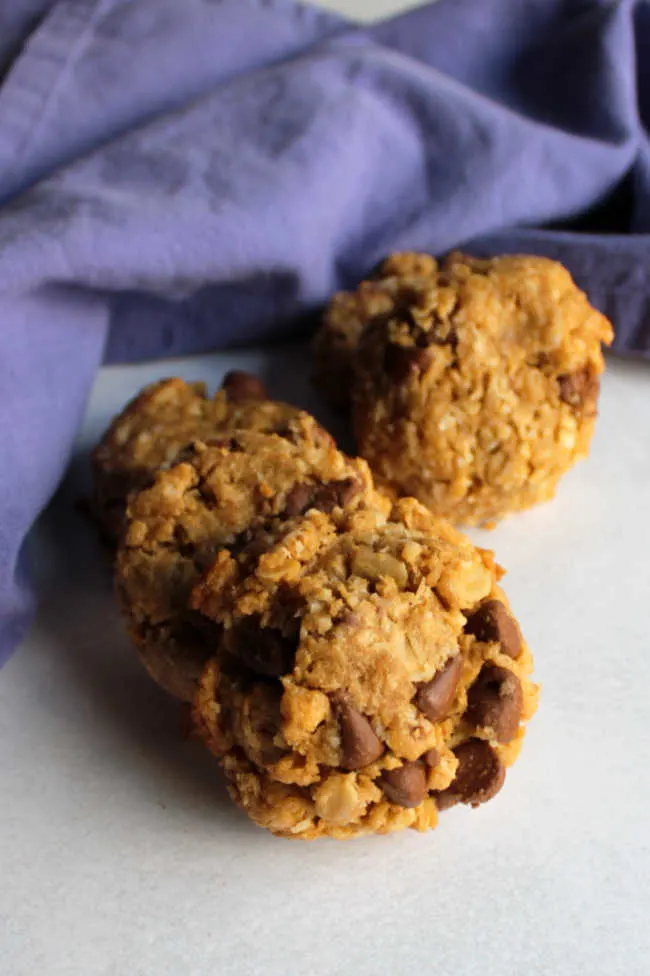 pile of chewy oatmeal cookies with peanut butter and chocolate.