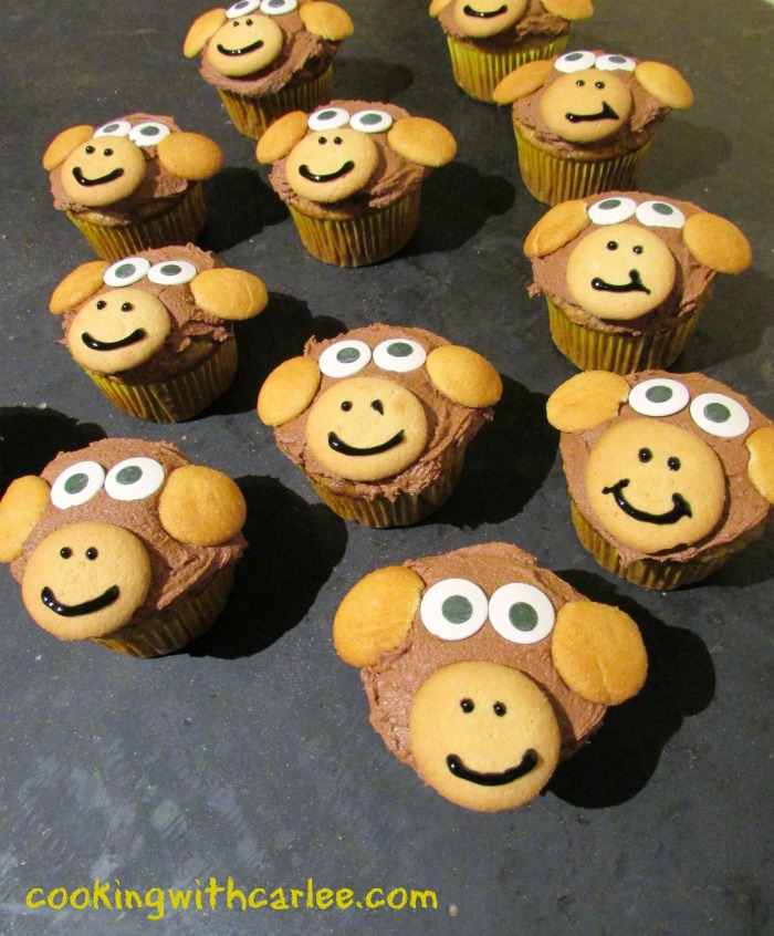 monkey cupcakes with chocolate frosting, vanilla wafers and candy eyes.