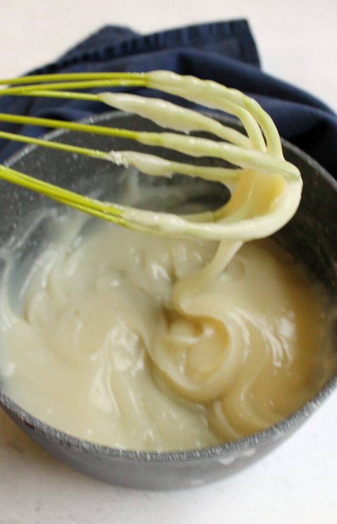 thick boiled milk paste in saucepan ready to be chilled and used in ermine frosting