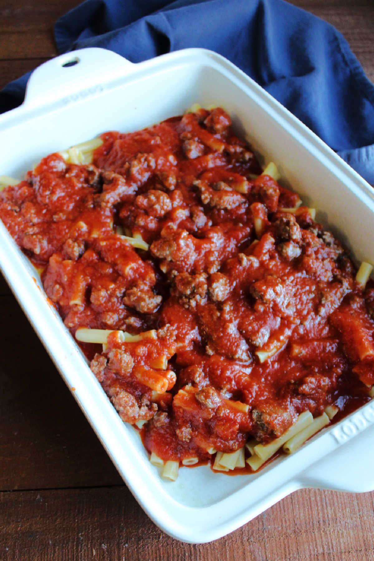 Layer  of al dente ziti pasta and meat sauce in 9x13-inch pan.