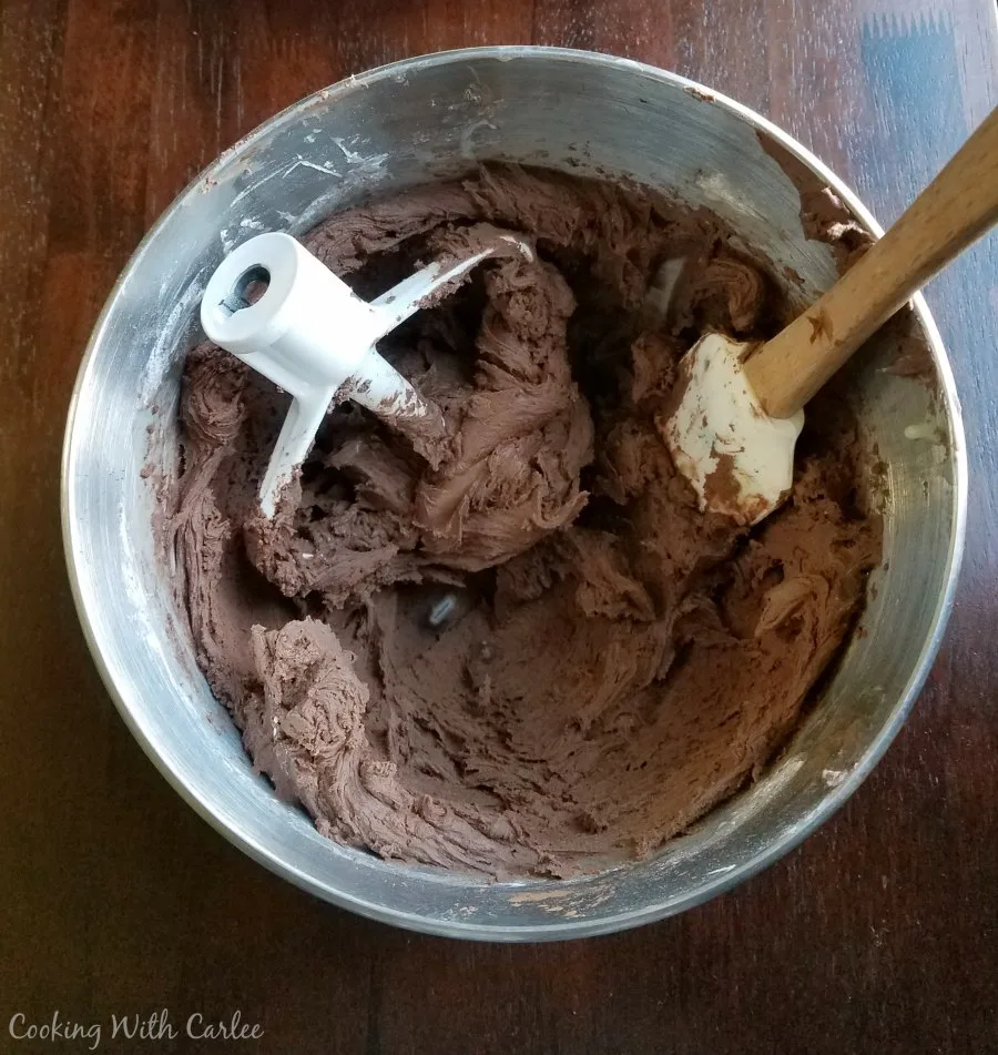mixer bowl filled with chocolate frosting