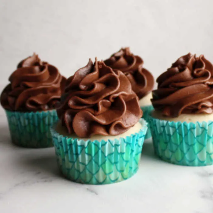 cupcakes with ruffles of chocolate sweetened condensed milk buttercream on top