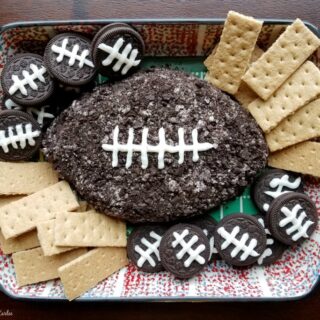 chocolate football shaped cheese ball with cookies for dippers.