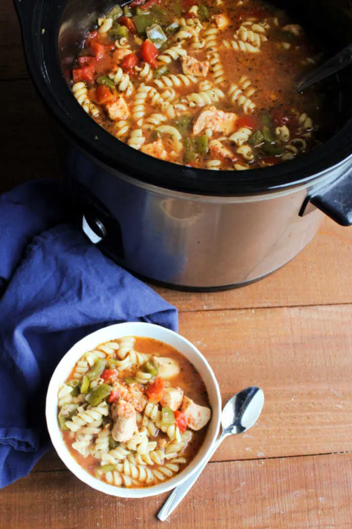 bowl of Italian chicken pasta soup by slow cooker.