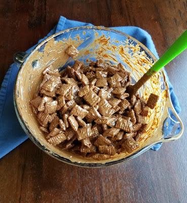 bowl of chocolate and peanut butter coated chex cereal