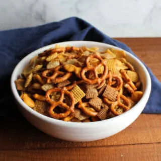 bowl of classic chex with cereals, pretzels and peanuts mix ready to eat.