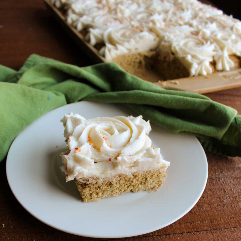 Piece of pumpkin spice cookie bar with rosette of marshmallow buttercream piped on top.