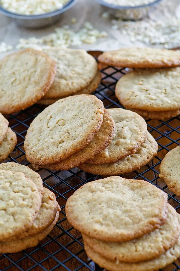 golden buttery ranger cookies made with a cup of several different things ready to be eaten.