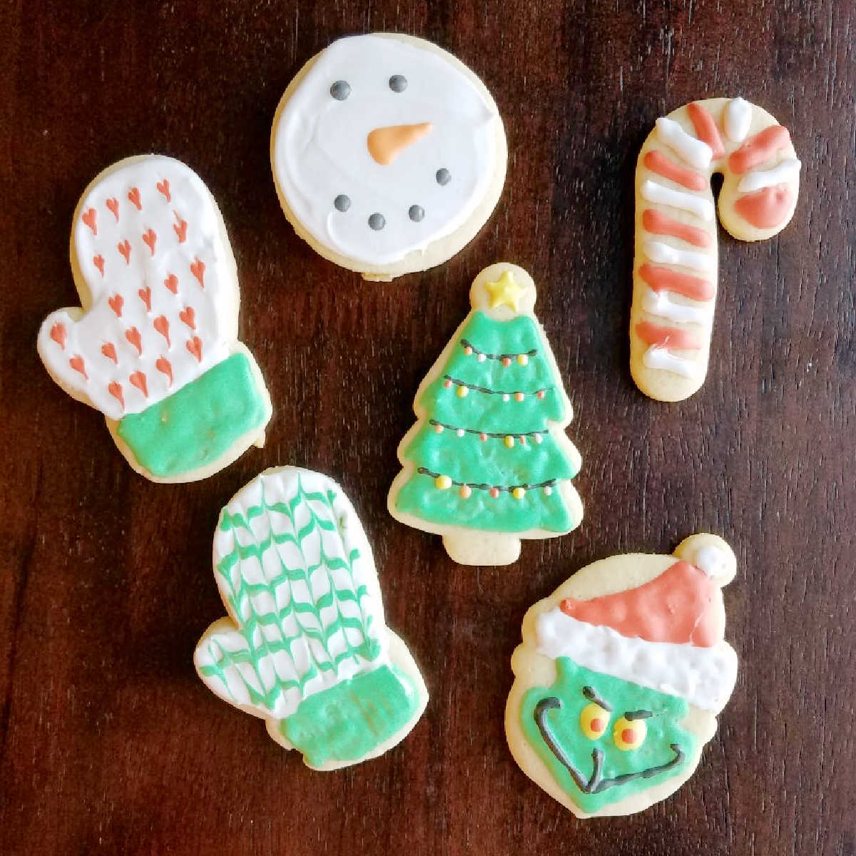 Sugar cookies rolled and cut in Christmas shapes decorated with royal icing.