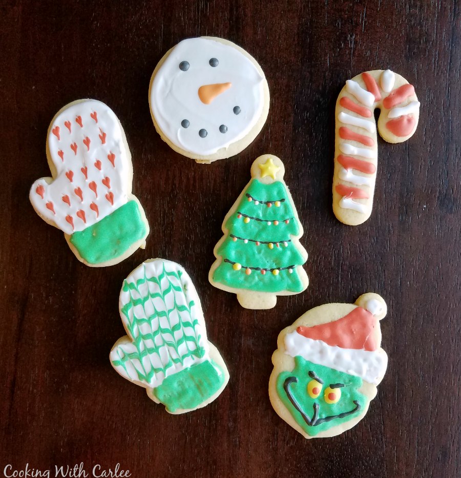 Go to sugar cookies cut into christmas shapes and decorated like mittens, the Grinch, a candy cane, snowman and Christmas trees with royal icing.