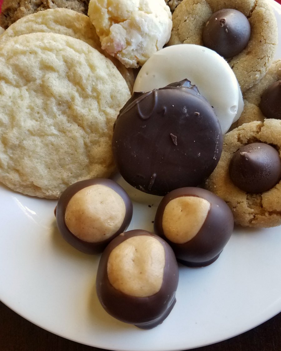 peanut butter buckeyes on tray with other Christmas treats.