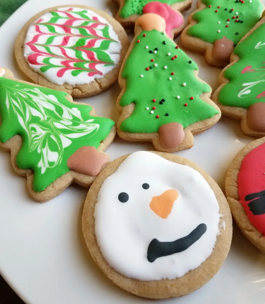 christmas peanut butter cookies decorated with royal icing.