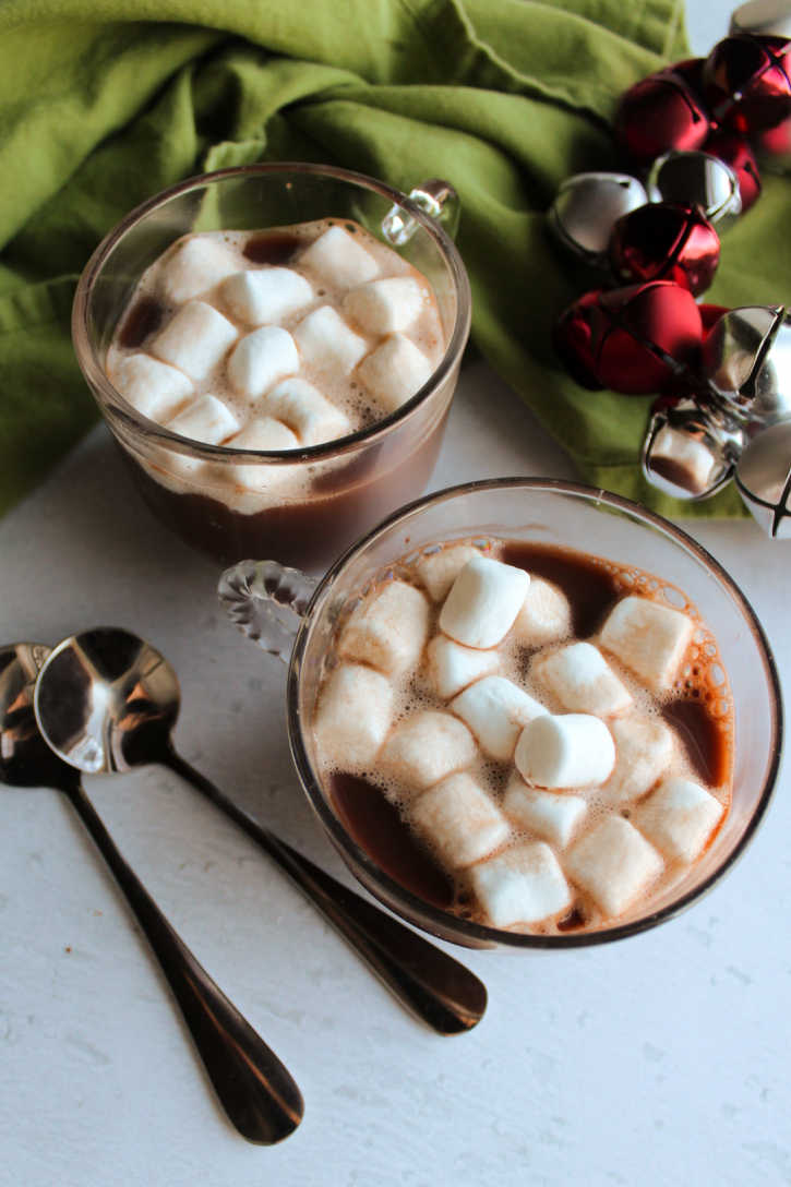 glass mugs of hot chocolate with marshmallows.