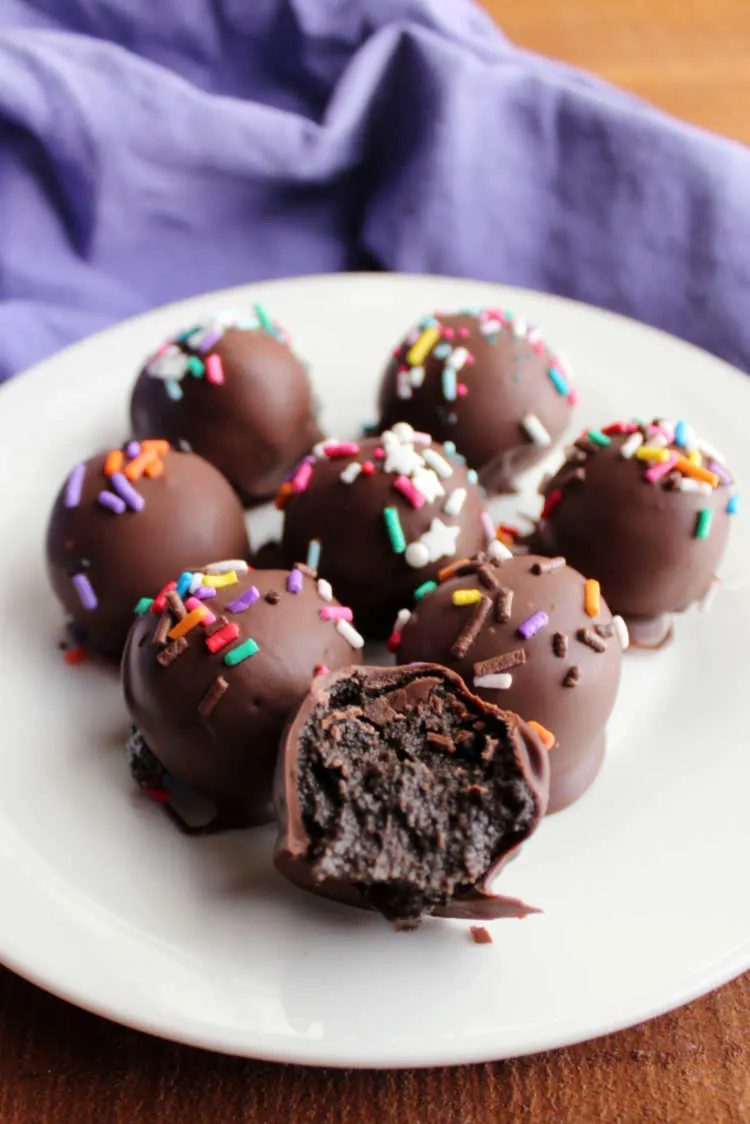 plate of peanut butter oreo balls with colorful sprinkles.