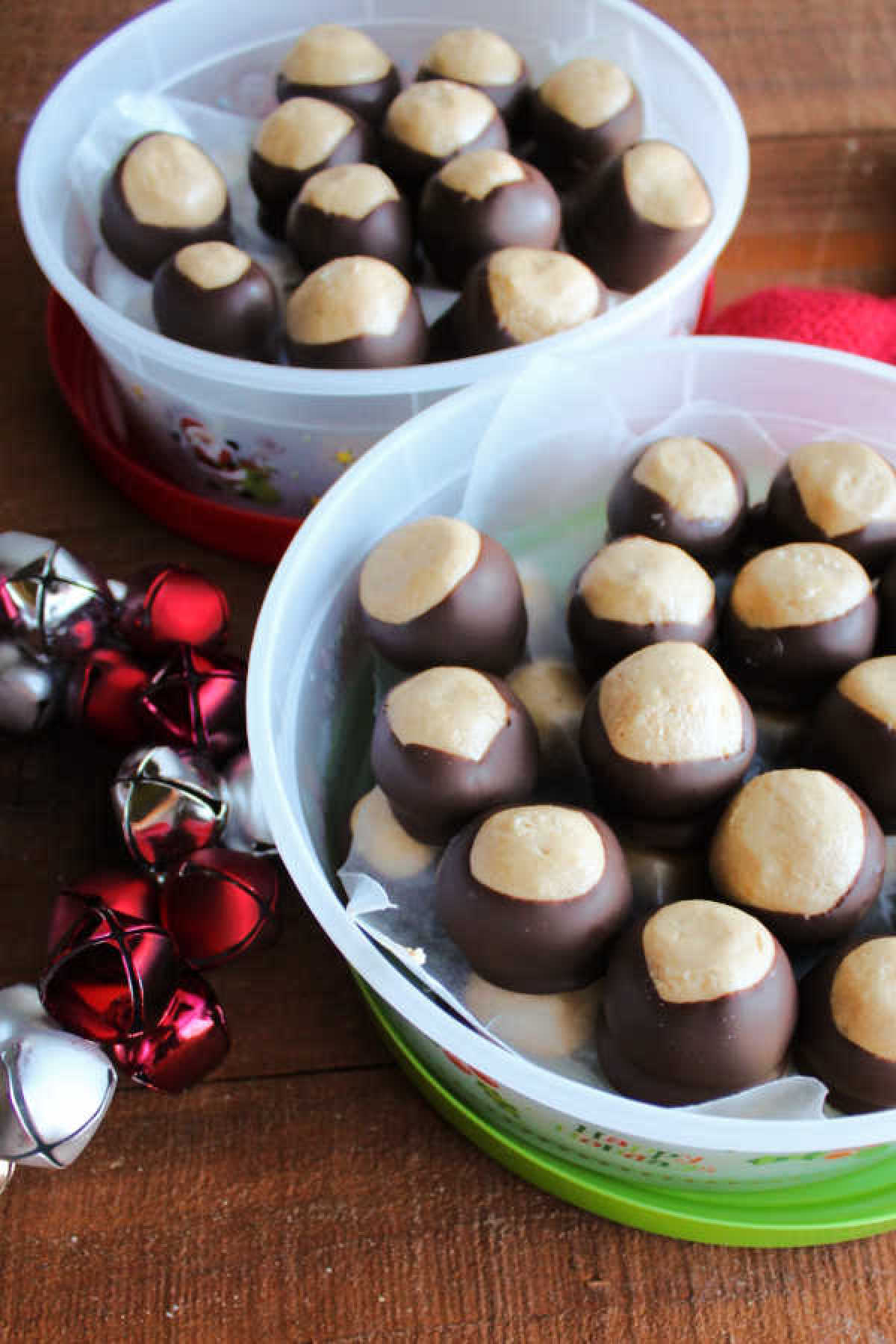 plastic containers filled with homemade peanut butter buckeyes for gifting.