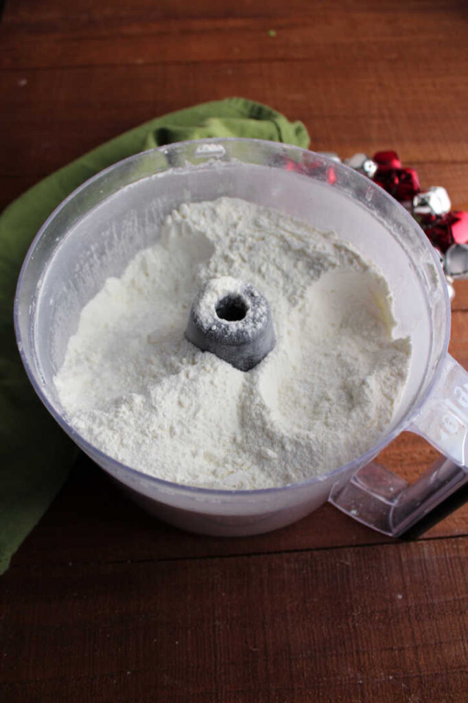food processor filled with powdery white hot chocolate mix.