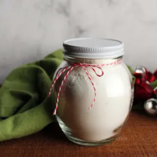 jar of white hot chocolate mix with a bow tied around it, ready to gift.