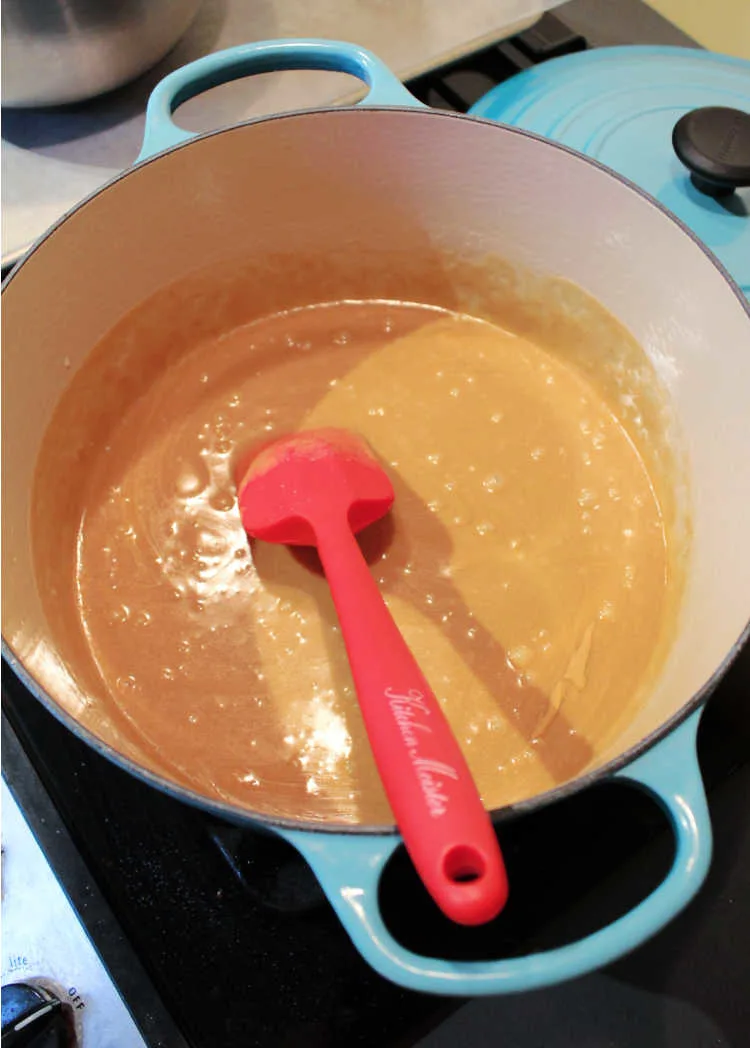hot peanut butter caramel mixture in dutch oven.