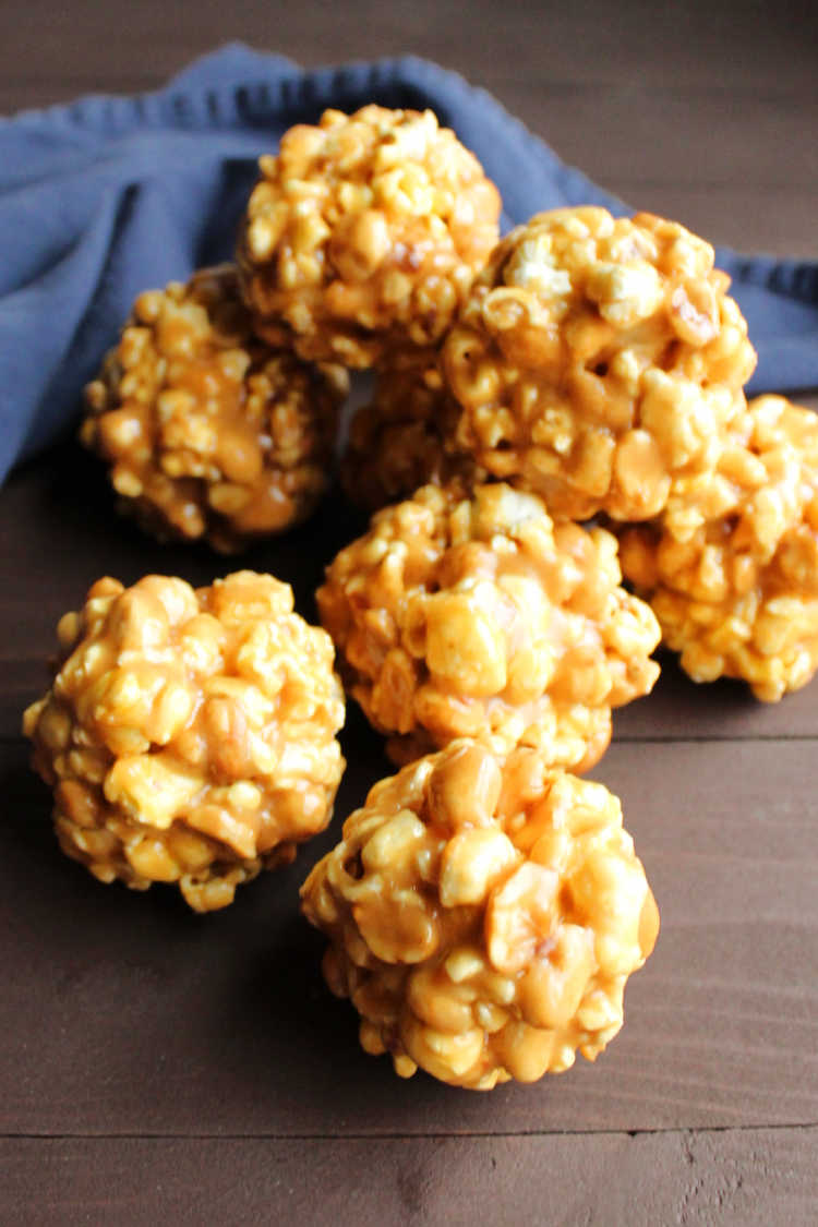 Pile of peanut butter popcorn balls, ready to be wrapped.