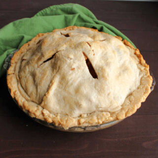 apple pie with golden homemade lard pie crust.