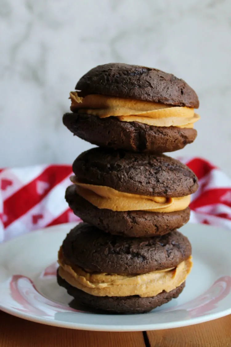 stack of chocolate cakey whoopie pies with peanut butter filling