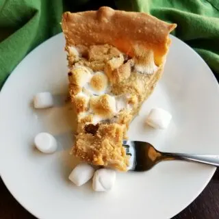 slice of peanut butter cookie pie with mini marshmallows baked inside.