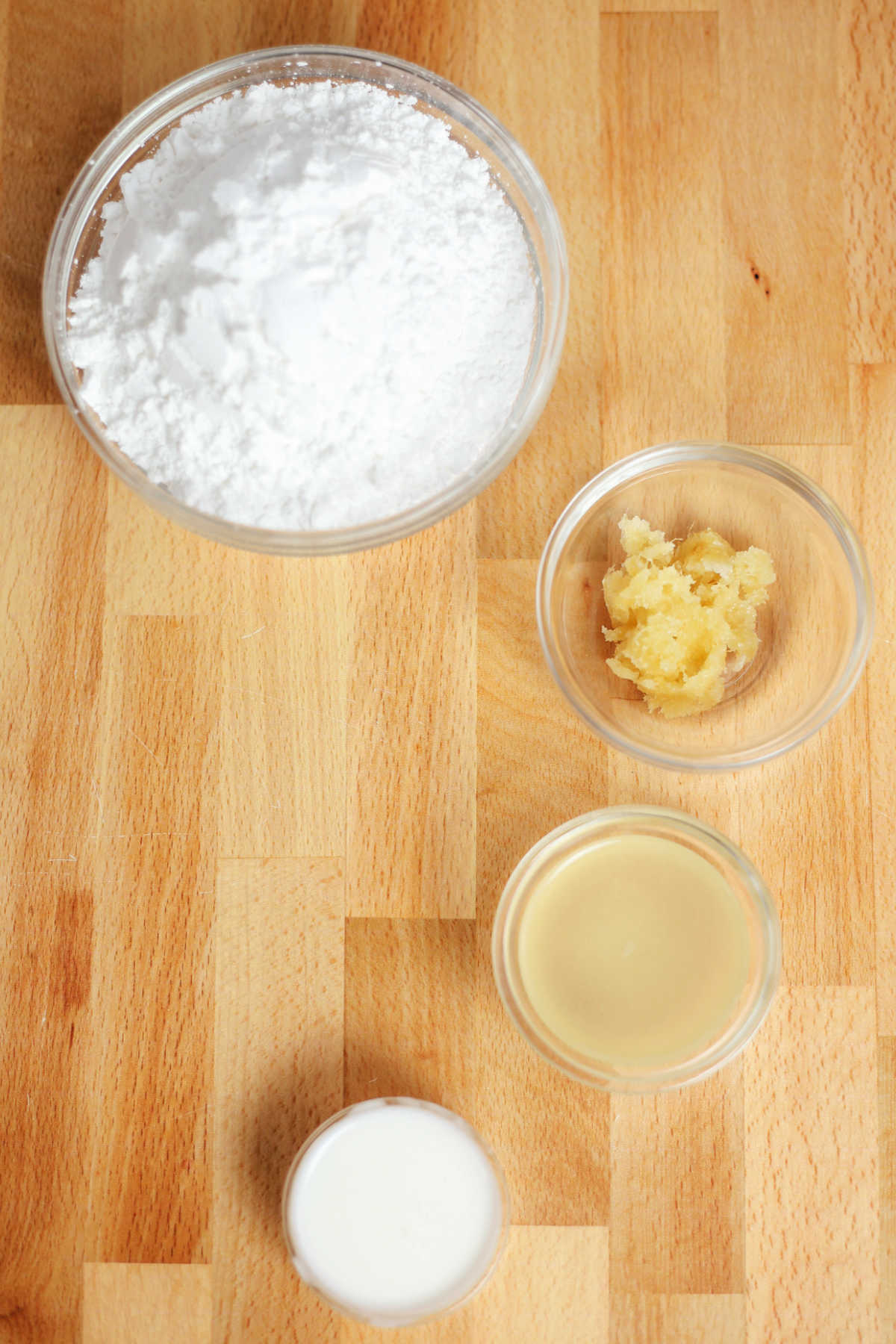Ingredients for lemon ginger powdered sugar glaze.
