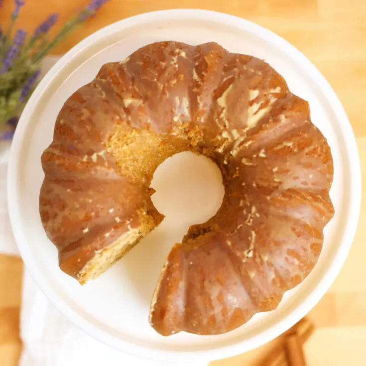 looking down on chai spiced bundt cake with espresso glaze on serving platter, ready to serve.