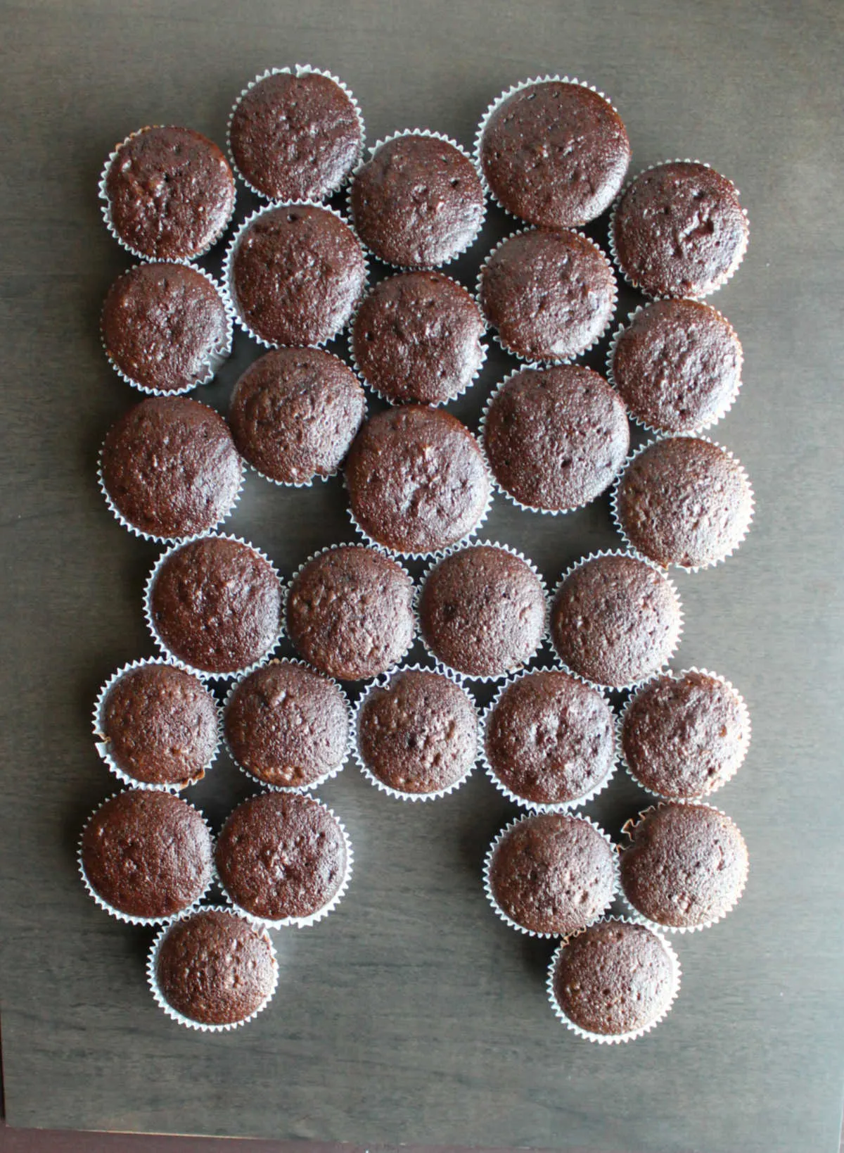 chocolate cupcakes arranged in tooth pattern.