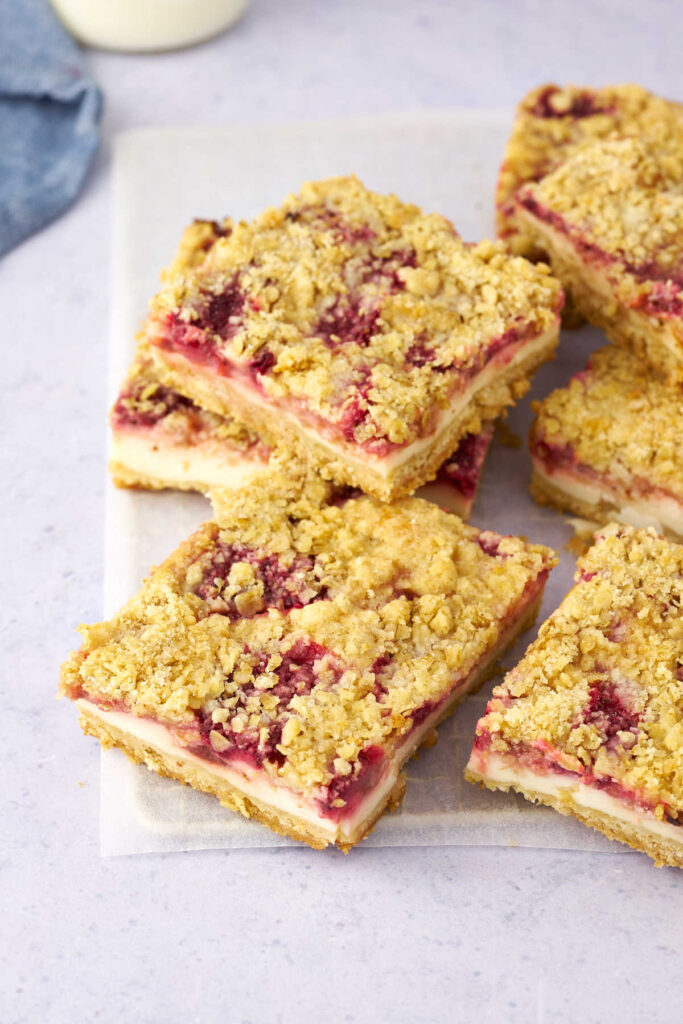 pieces of strawberry yogurt bars with oatmeal crumb topping.