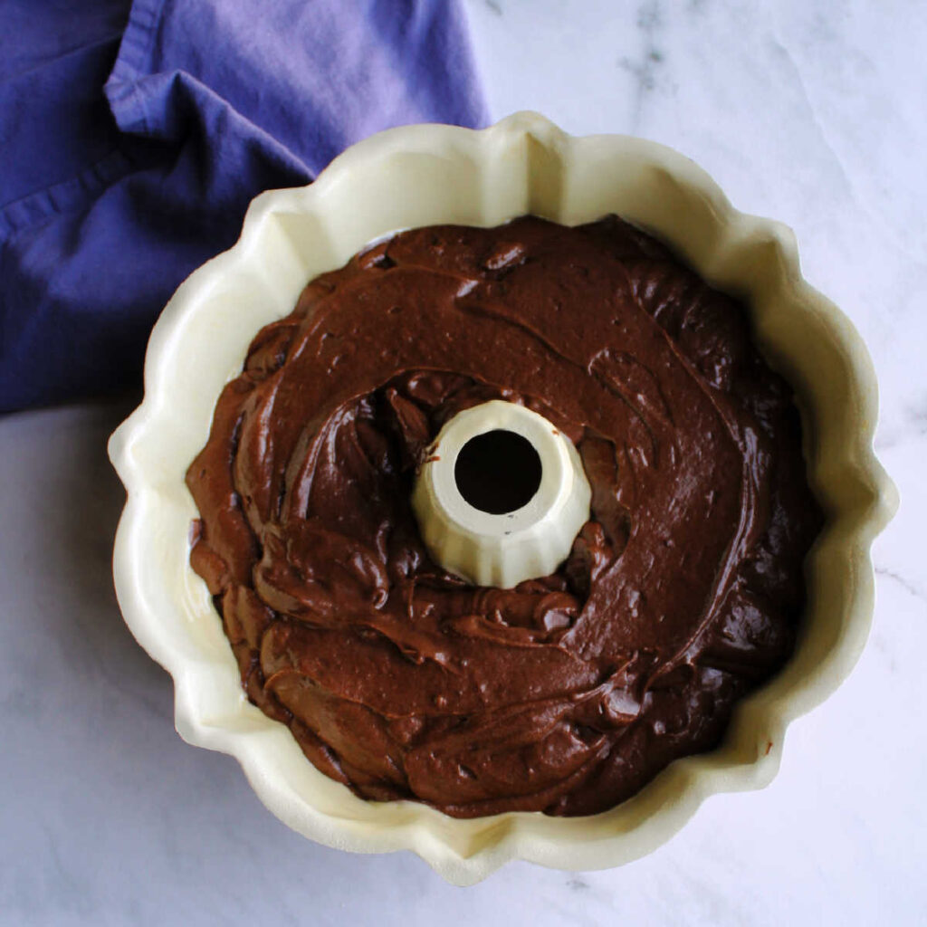Chocolate cake batter in bundt pan.