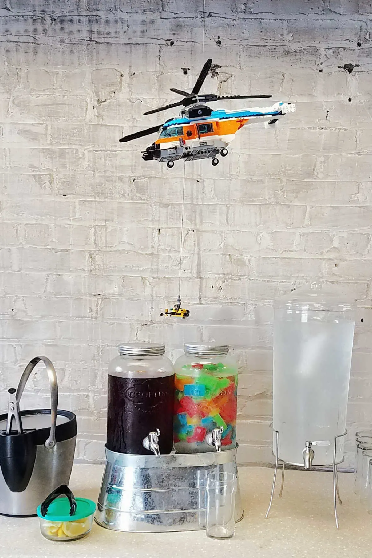 Beverage area with Lego helicopter floating over it.