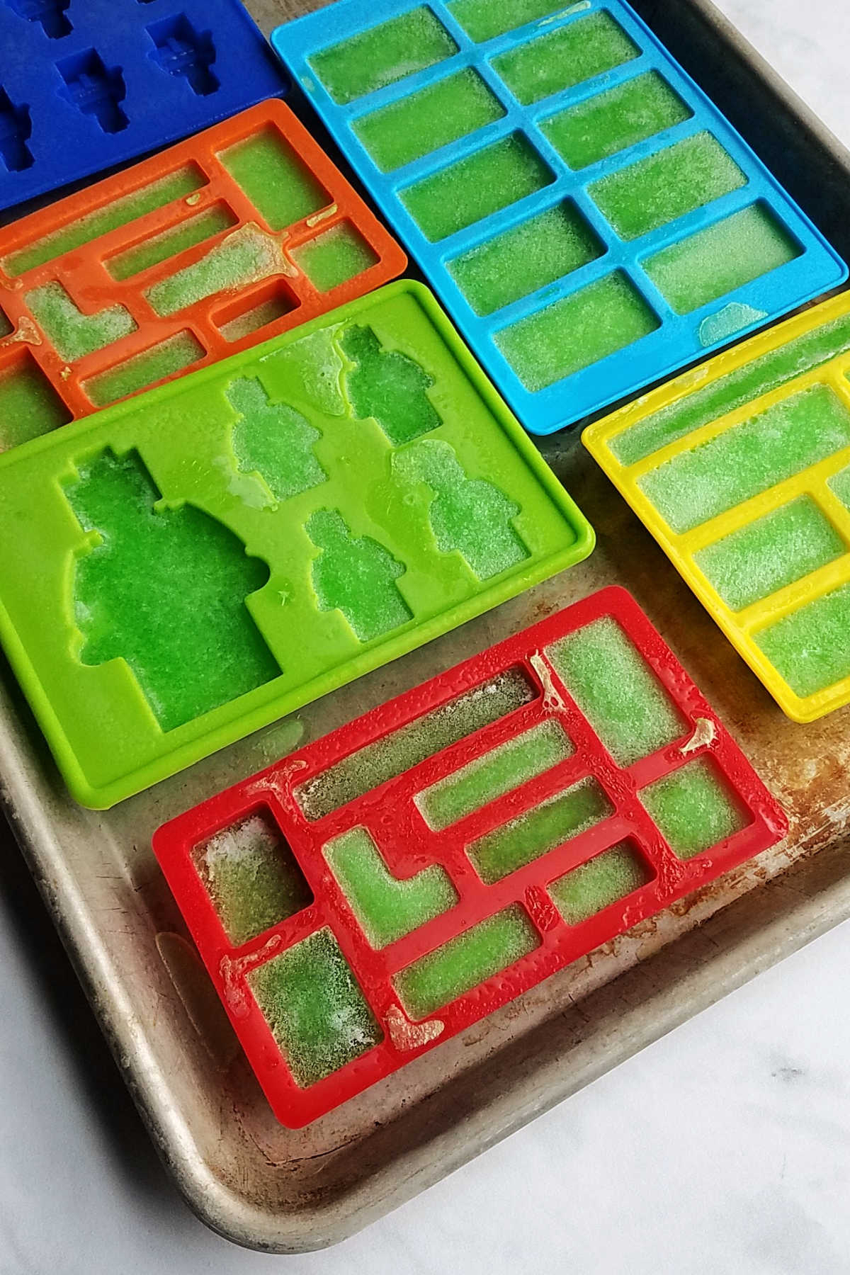 Silicone molds in lego shapes with jello inside.