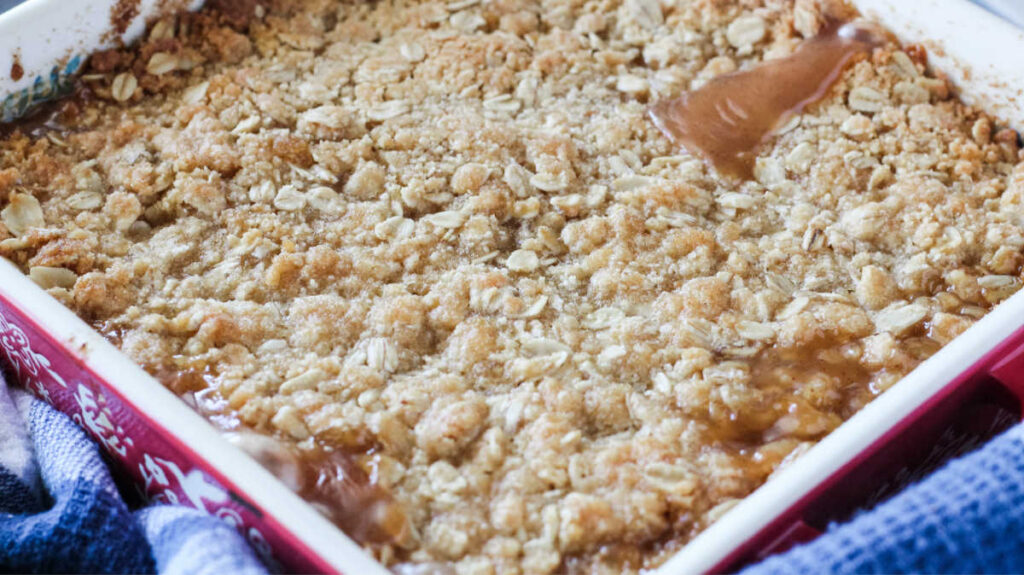 freshly baked zucchini apple crisp with gooey brown sugar and oat topping.