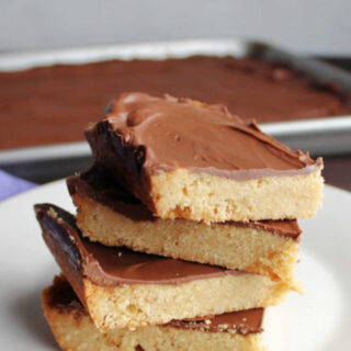 Stack of toffee cookie bars on plate.