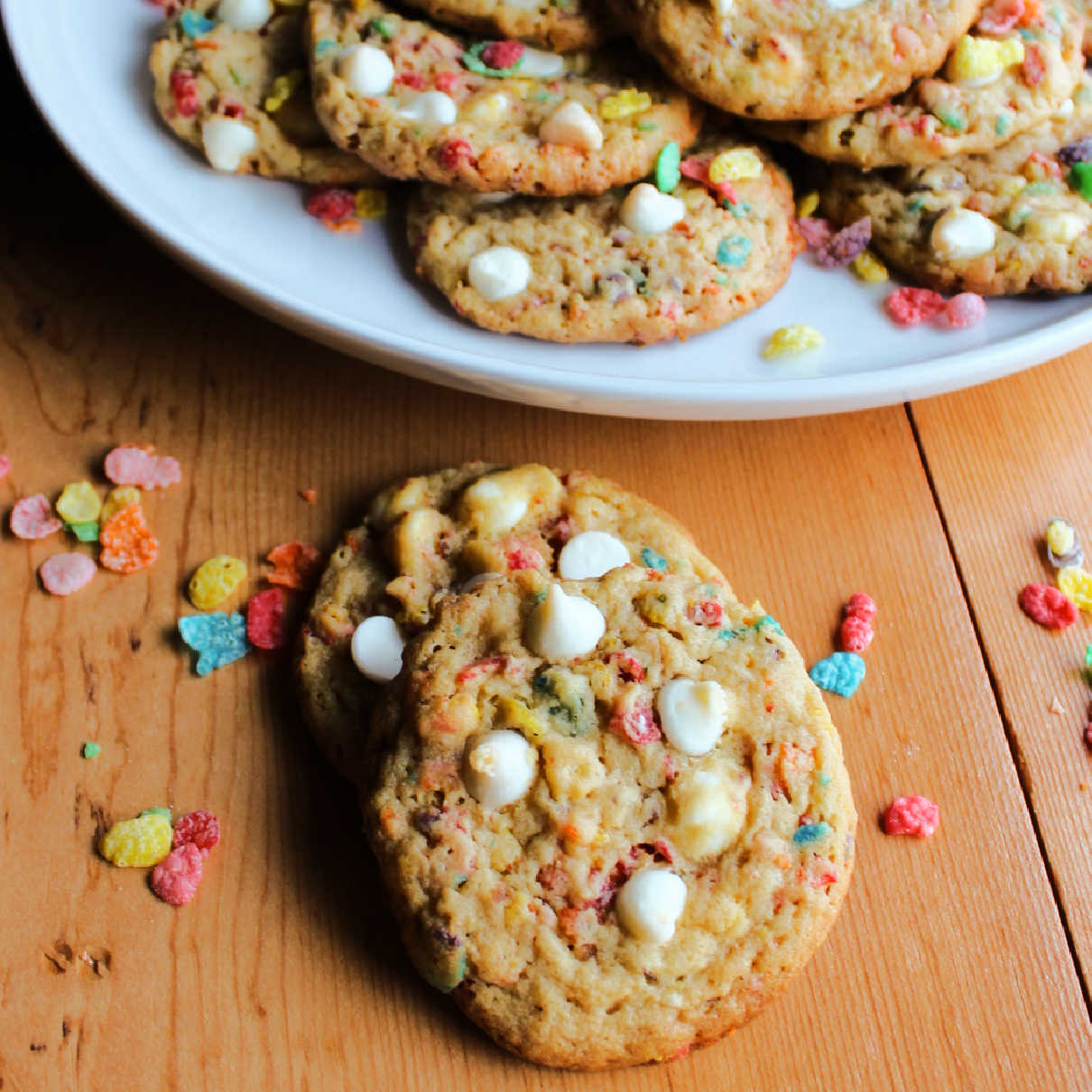 Colorful fruity pebble cookies with white chips.